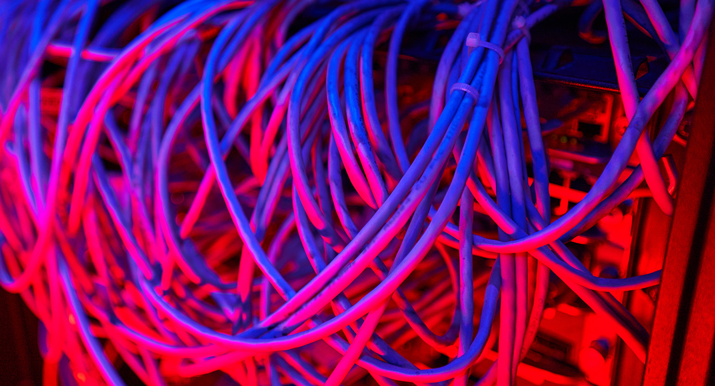 A mass of cables connected to a computer server